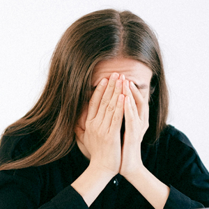 Woman appearing stressed