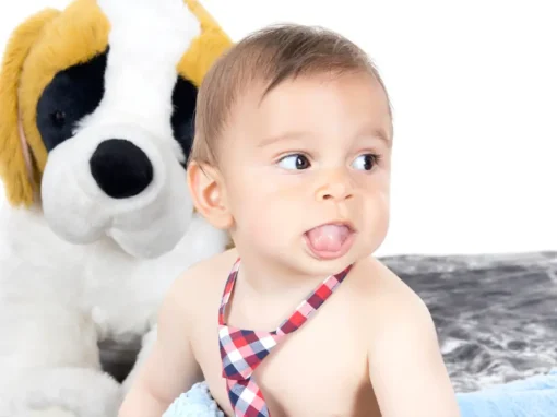 Infant with the tongue extended, showing restricted tongue movement