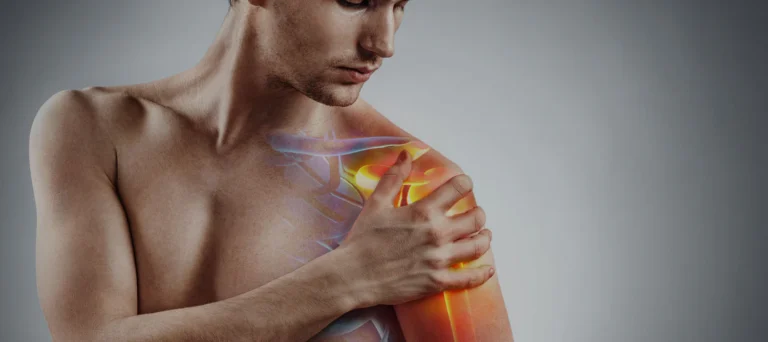 Man holding his shoulder with the inflamed joint highlighted in glowing orange